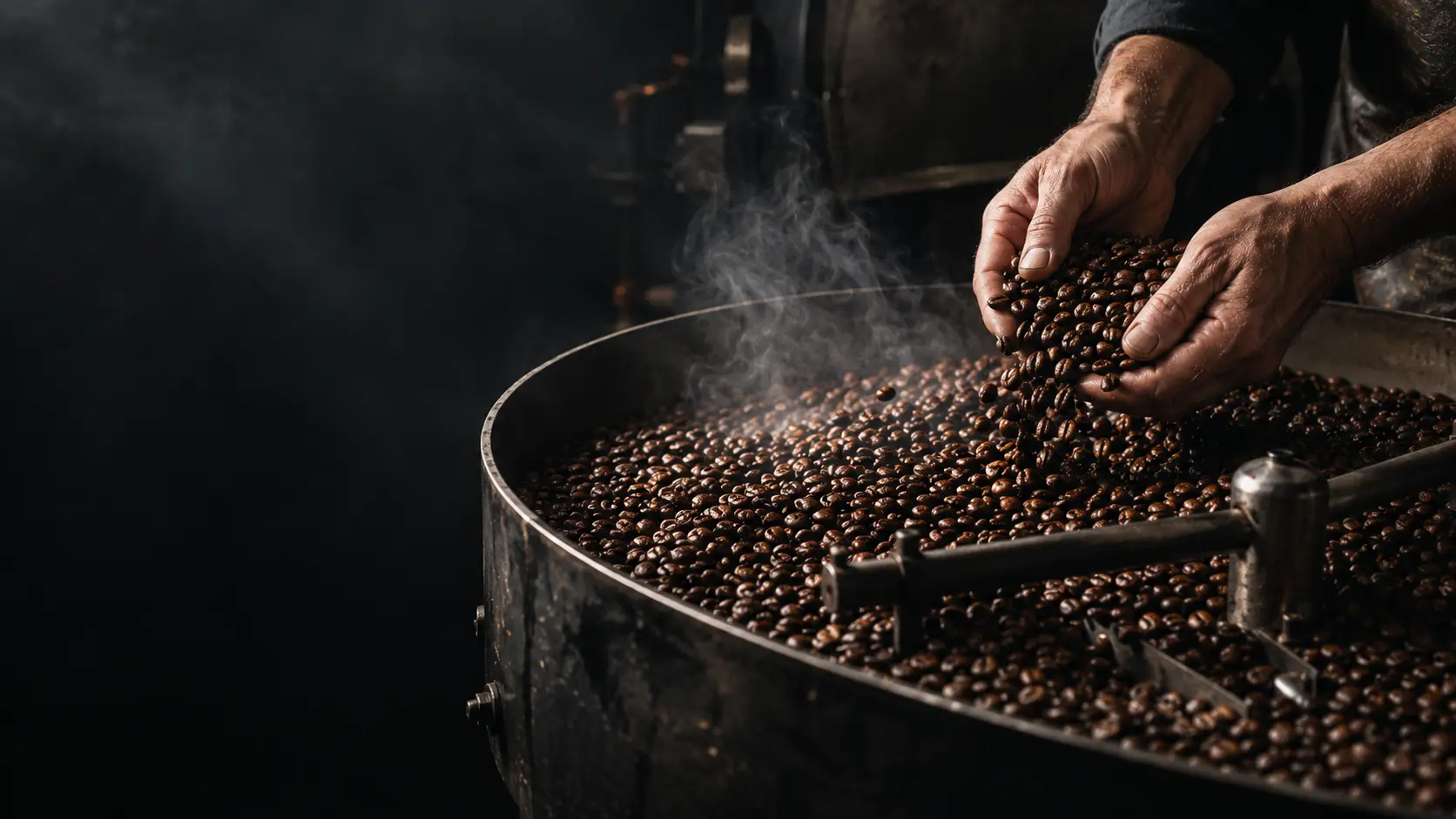 Freshly roasted coffee beans cooling in a steel tray